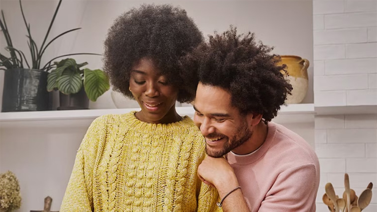 Two people prepare food in a kitchen