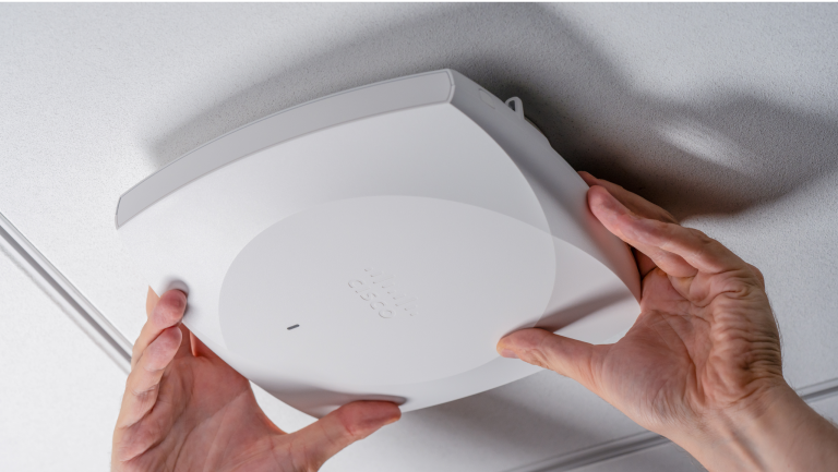 Wireless router being installed on ceiling