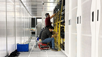 Technician working on a data center to make it AI-ready