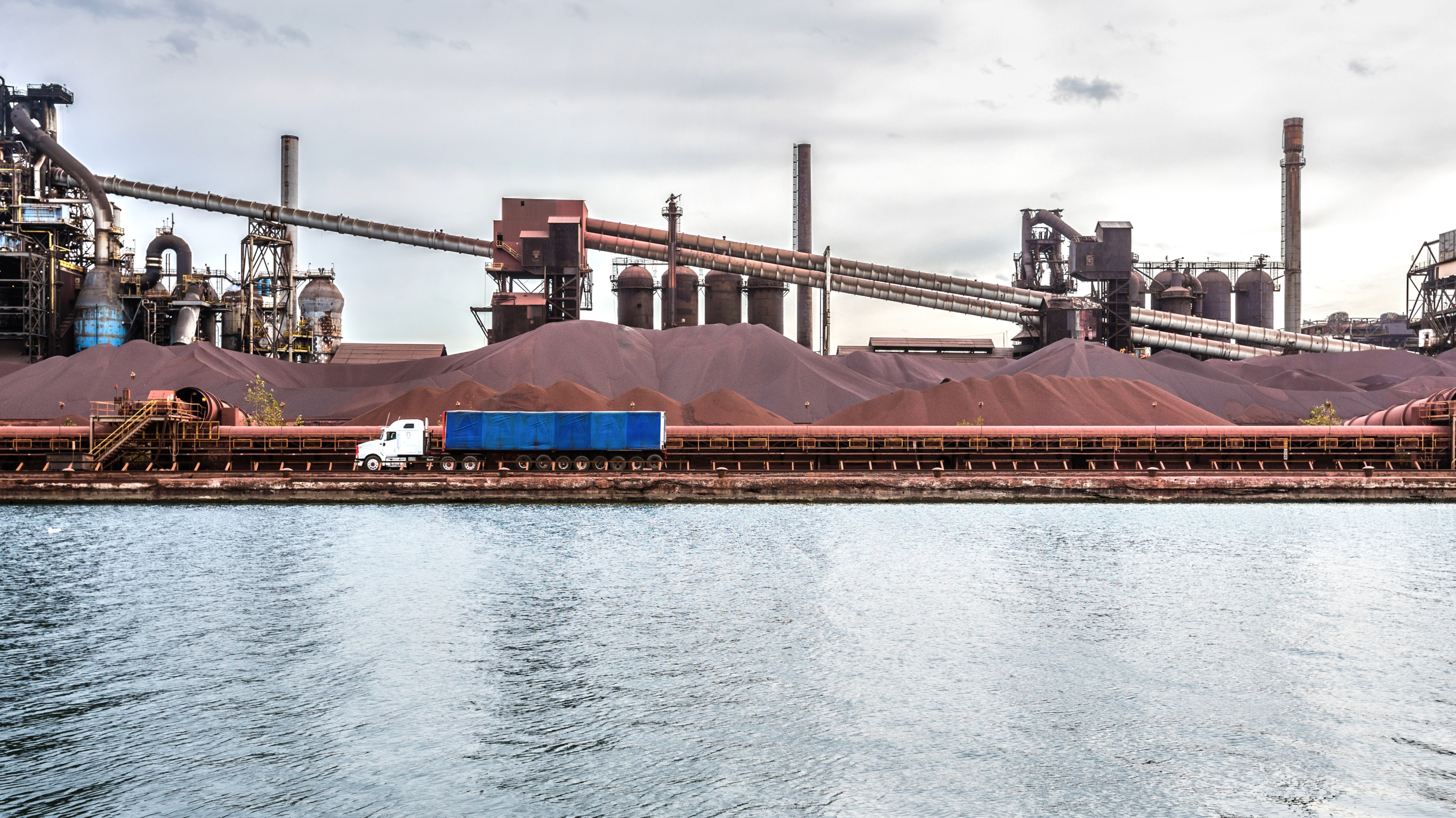 Body of water next to industrial plant